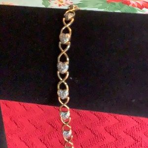 Gold tone over sterling silver (I think)